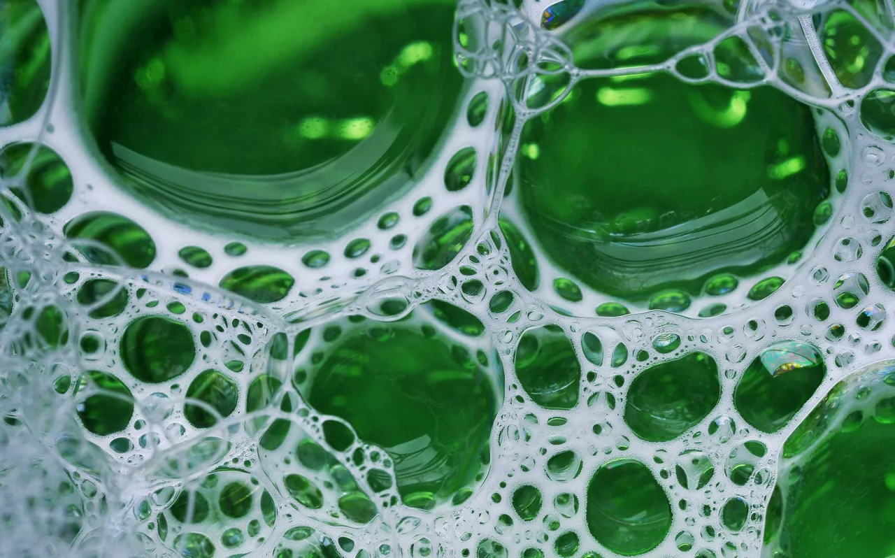 Cleaning product with white foam bubbles 