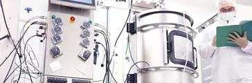 Scientist working with a bioreactor